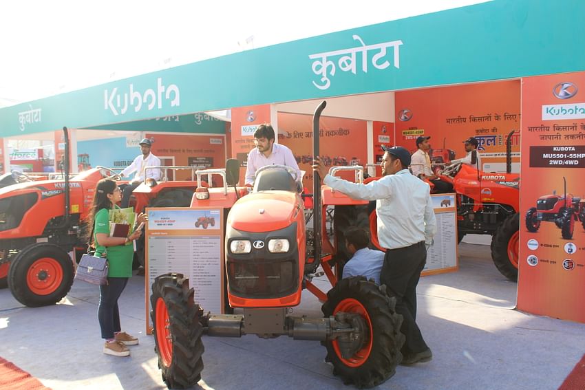 farmer trying hands on the new tractor