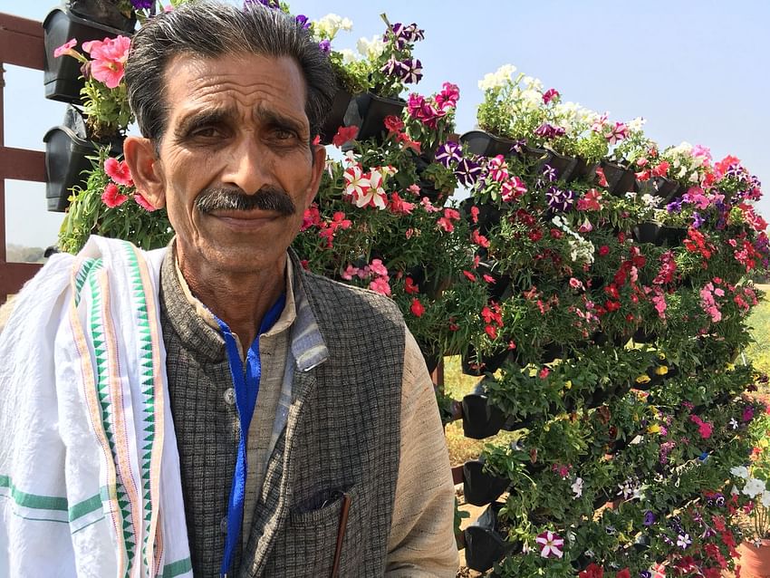 farmer posing at the floriculture section