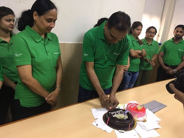 Editor in chief cutting cake on behalf of MS Swaminathan